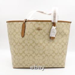 Coach Signature Coated Canvas City Tote with Top Handle in Lt Khaki/Lt Saddle